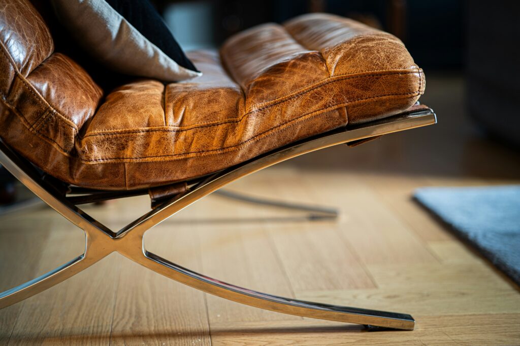 a modern leather chair recovered in a two tone leather finish genuine leather